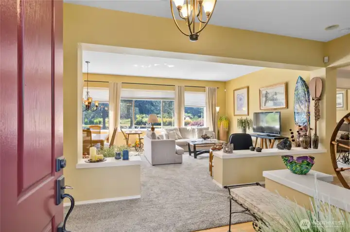 Front entry foyer looking into living room and outside to your beautifully maintained yard and view!