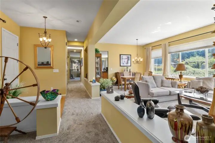 Front foyer area looking down hallway and into the living and dining room.