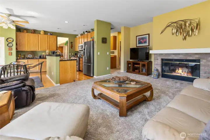 Family room looking into the kitchen with eating area, light and bright in here.