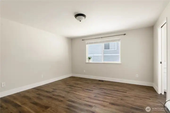 Primary bedroom is well designed with wall space for dressers, desks etc...