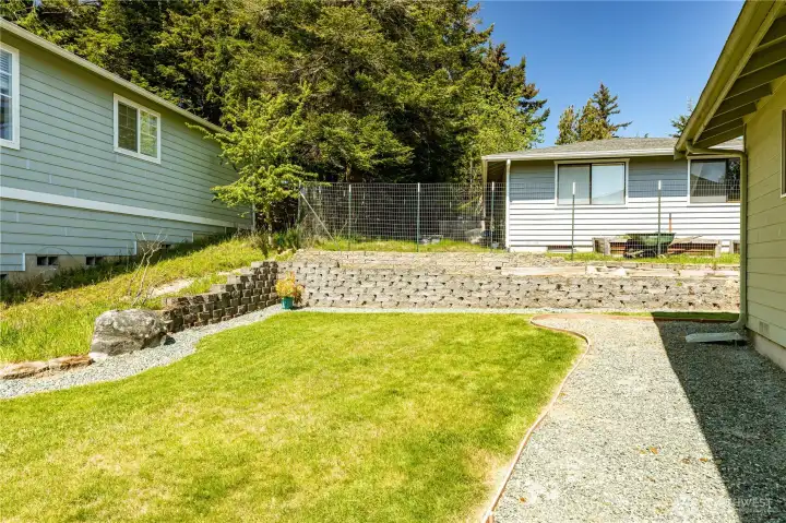 Nice level back yard with walking paths