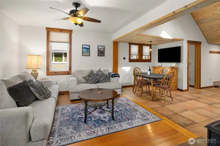 This open floor plan does not disappoint, and look at the original fur floors in the living room. Very cozy and welcoming for sure!
