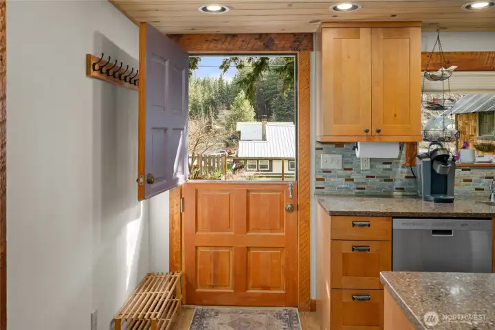Beautiful sold wood Dutch door out to the back yard. Great for fresh air or just keeping an eye on a dog or little ones in the back yard.