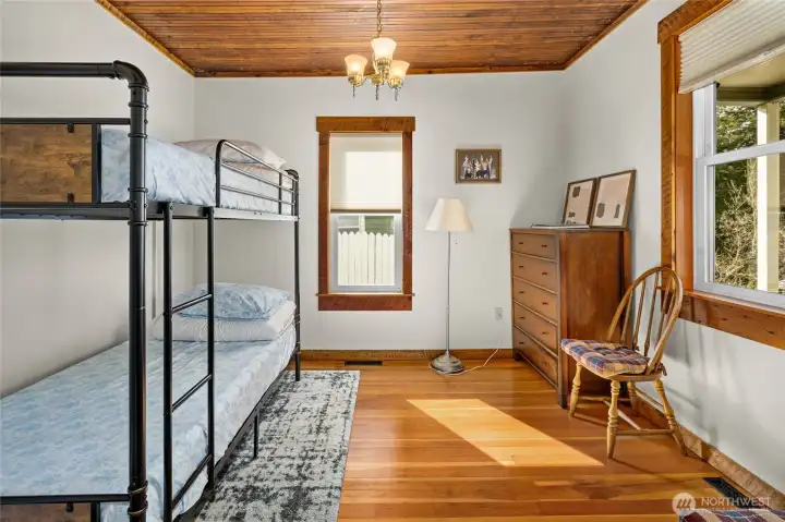 The original bead board ceiling adds to the charm in this room along with the original fur floors. So much natural light from both windows in this room.