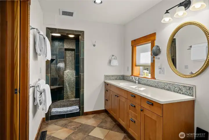 Updated main floor bathroom. The large bathroom has plenty of space for ease of use, very luxurious feeling.