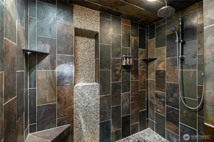 Gigantic custom tile shower in bathroom. What a lovely spa experience in this shower.