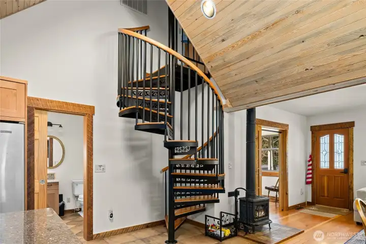 Oversized spiral stair case to the upper floor bedroom. These stairs have extra size and makes it very easy to go up and down.