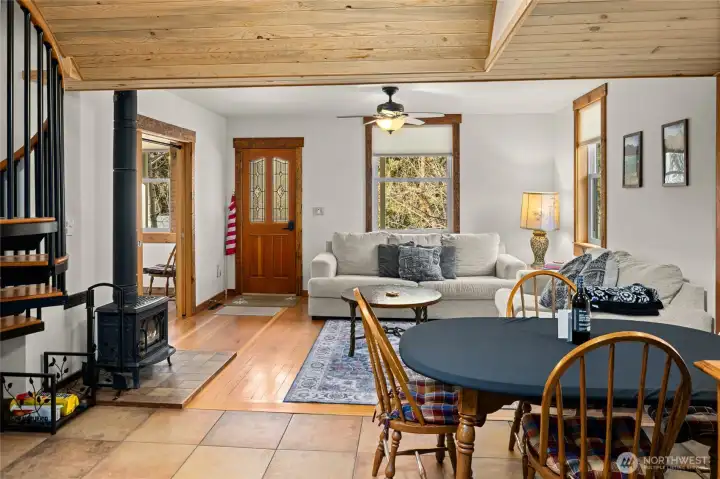 A view from the dining room looking back to the living room and front door area. The gas fireplace is perfect for those cozy winter days.