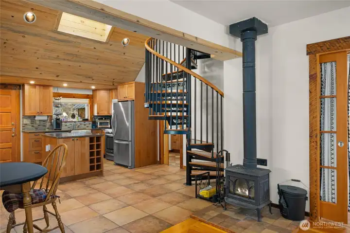 he fire place is tucked perfectly on this side here to allow for plenty of space. But don't let the size fool you, this little fireplace can heat the whole house, very well and very quickly.