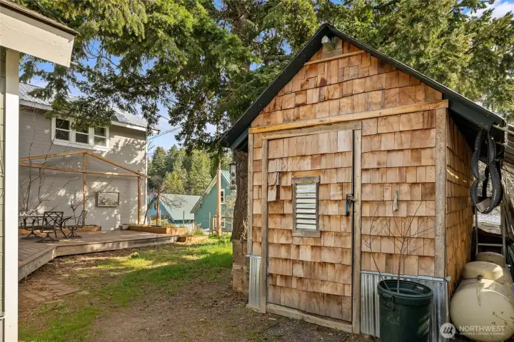 The cedar shake shed it the back is great for storage for yard tools, mower or anything you want.