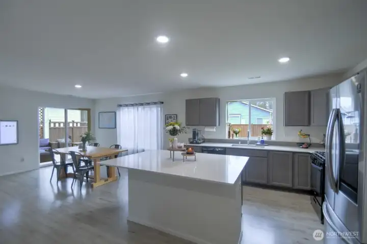 The stylish kitchen includes beautiful hard surfaced countertops, stainless steel appliances, and a huge island with breakfast bar! The stylish kitchen includes beautiful hard surfaced countertops, stainless steel appliances, and a huge island with breakfast bar!