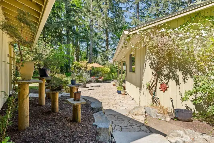 Flagstone walkway and patio leads you to your front door.