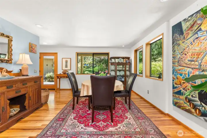 Spacious dining room with hickory hardwood floors.