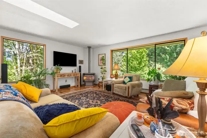 Living room with cozy gas fireplace that will heat the whole room during the colder months.