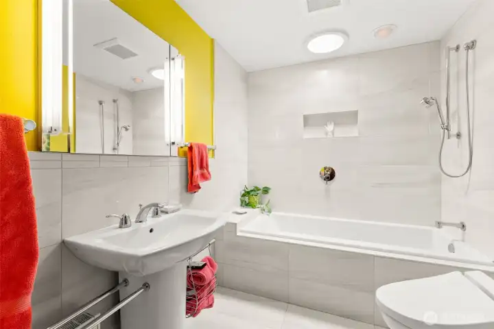 Crisp and clean, remodeled Primary bed en-suite.