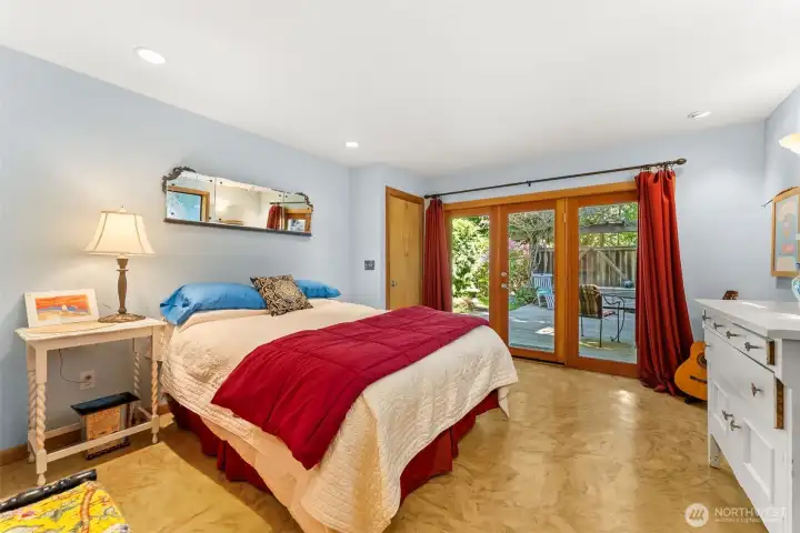 Bedroom 4 with large walk-in closet and access to lower level patio.