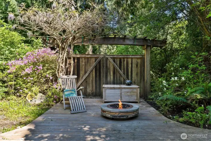 Lower level patio. Firepit is virtually staged. Would make an excellent space for a smokeless firepit and room for BBQ and more.