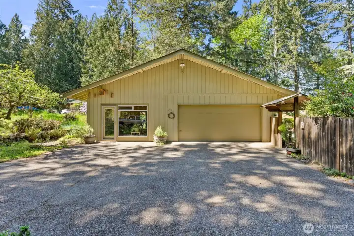 Spacious 2 car garage and dedicated studio on the left.