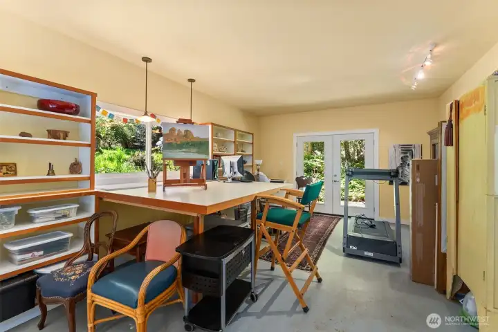 Multi-functional studio currently used as exercise space and art. So many options for crafting, yoga, or work from home option.