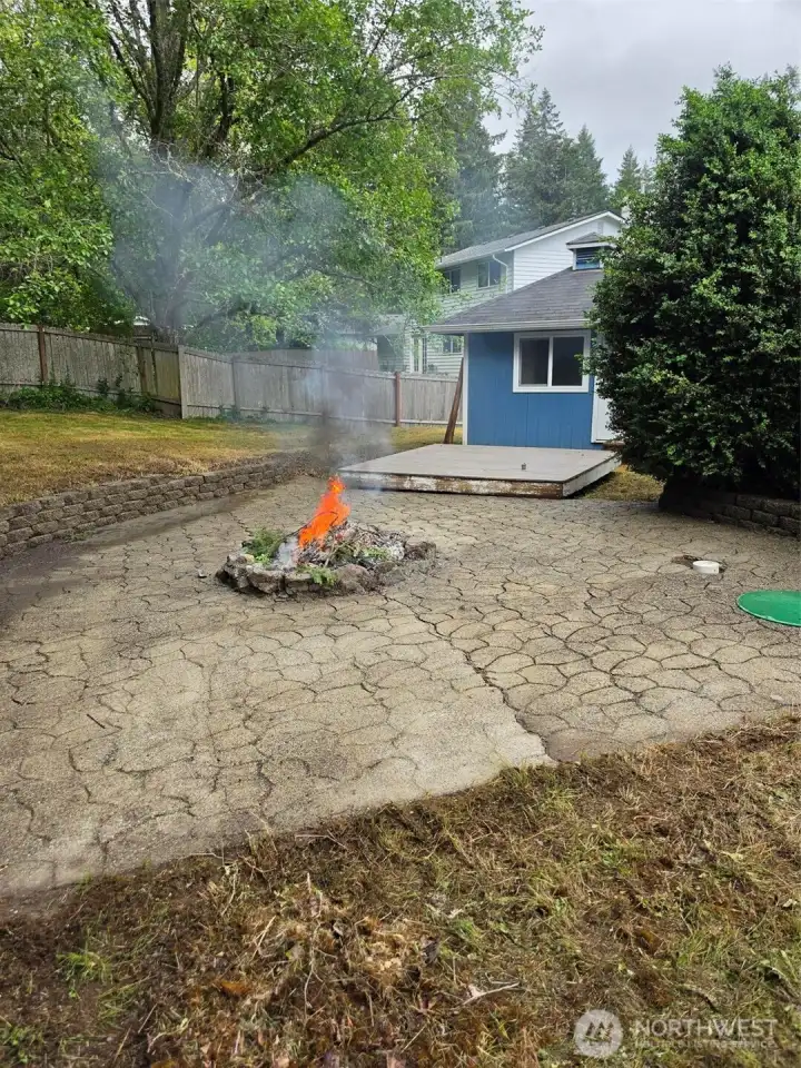 Back yard patio, fire pit & office/studio outbuilding.