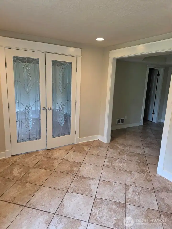 Eloquent glass french doors at Entry.