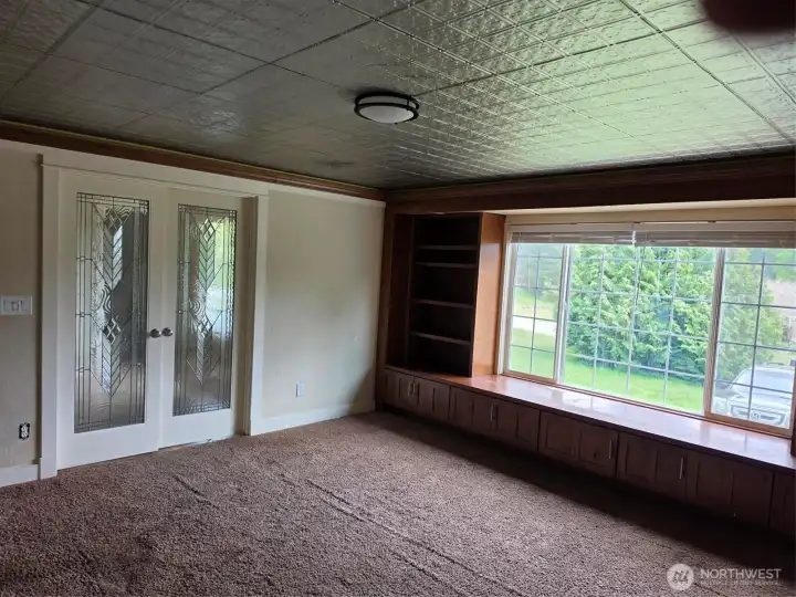 Office/studio/family room with eclectic tin ceiling.