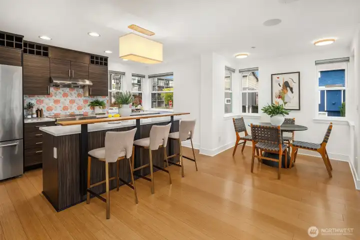 It's rare to find both a spacious, open kitchen and a dining area in a modern townhome without them feeling squeezed.