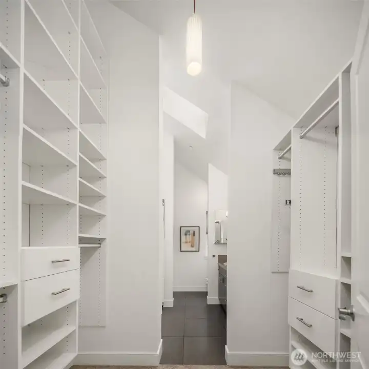 Floor-to-ceiling storage in the giant walk-through primary closet.