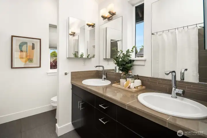 The primary bath (which could easily be turned into a Jack 'n' Jill) is modern and so very luxurious.