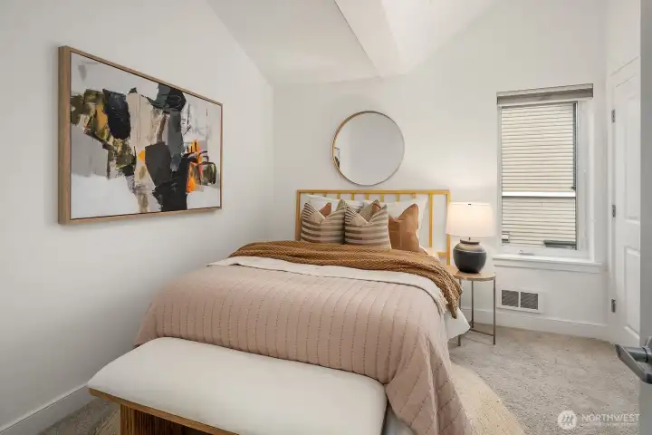 Second upstairs bedroom, with vaulted ceilings, a skylight, and two closets. Ask about bid to open closet to bathroom!