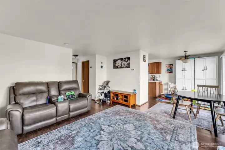 Unit #15334. Living room open to dining area.