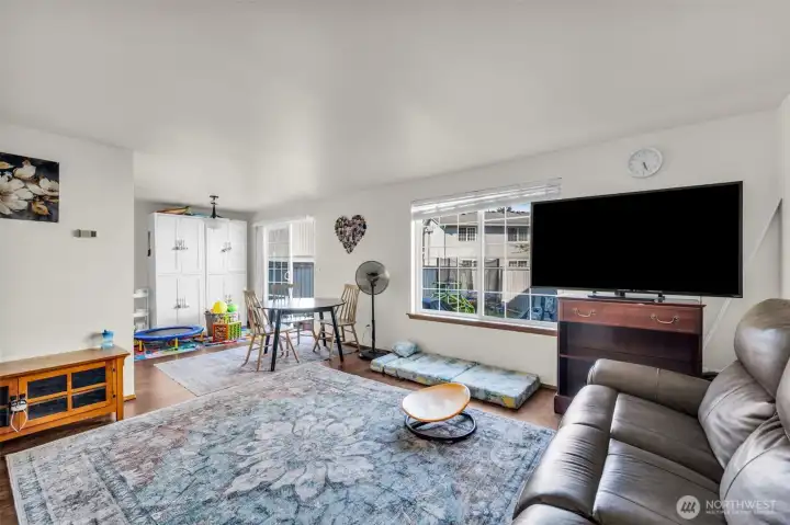 Unit #15334. Living room open to dining area.