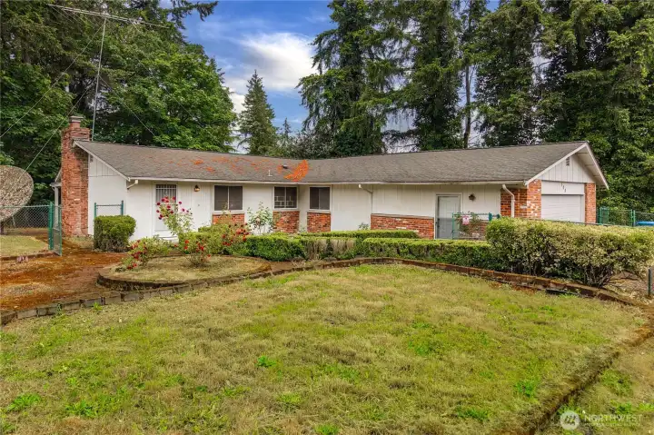 Fixer in need of your vision to make it shine again. Over 1500 SF and fully-fenced, mature grounds offer so much potential.