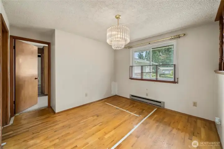 Still the dining room - showing the kitchen entry. The door on the far left enters the primary suite.