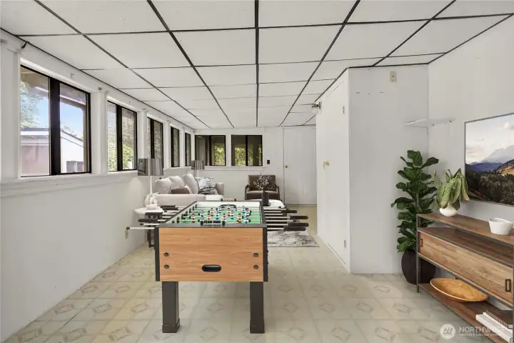 Virtually staged as a game room.