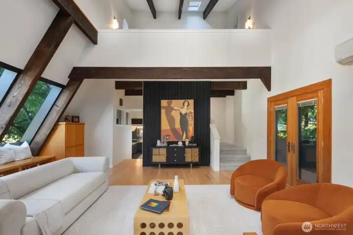 Vaulted ceilings with exposed beams in living room