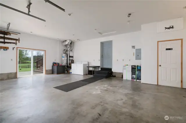 Spacious garage is 750 sq/ft and has a convenient half bath on the right. Furnace and Water Heater were replaced in 2019. Washer and dryer are older but work well, and stay.