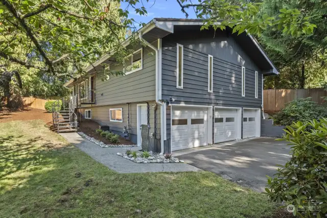 Three car garage plus lots of space in the driveway.