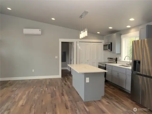 NOTE THE EFFICIENT DUCTLESS HEAT PUMP ON THE BACK WALL FOR WINTER HEATING AND SUMMER AIR CONDITIONING!