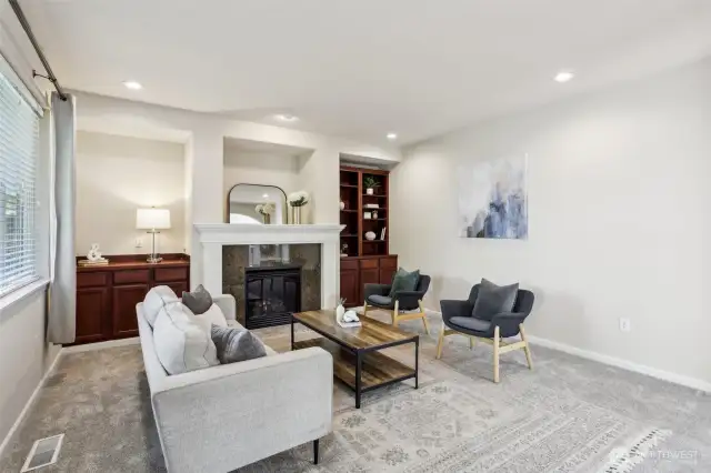 Custom built in cabinets and a gas fireplace
