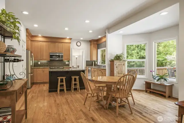 The informal dining area is conveniently in between the kitchen and family room and has a door that leads to the deck and backyard.