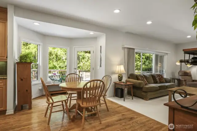 The informal dining area is conveniently in between the kitchen and family room and has a door that leads to the deck and backyard.