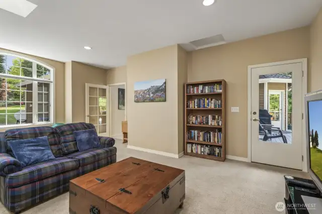 . The media or rec room is located through a door right off the family room; a nice square room to enjoy a multitude of activities.