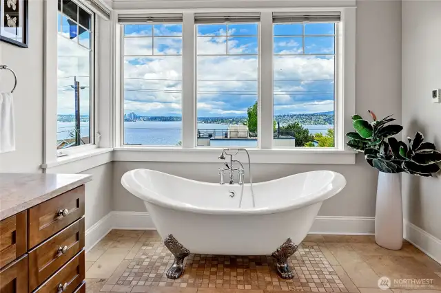Deep soaking tub with views of the lake and mountains.