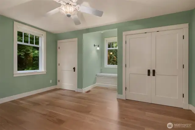 Guest bedroom with secret room, double closets, built-in nook seating with storage