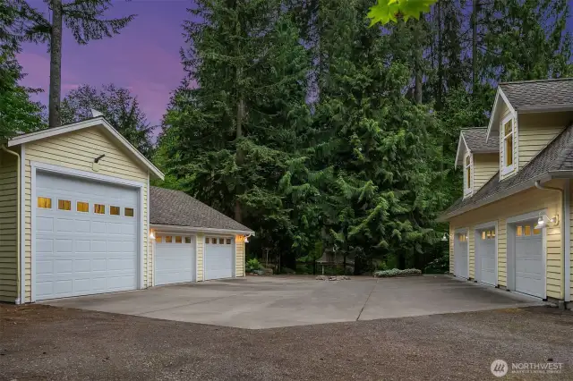Attached 930 SQ FT 2-car-garage (with half bathroom) and detached 1168 QFT garage with RV/Boat bay