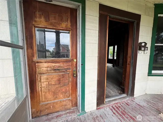 Two separate entrances. Door on the left leads to the upstairs units.