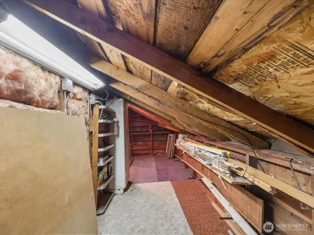 One of two generous walk-in attic spaces—offering tons of storage and endless possibilities!
