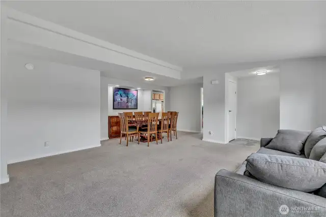 Living room / dining area. Freshly painted and new carpeting.