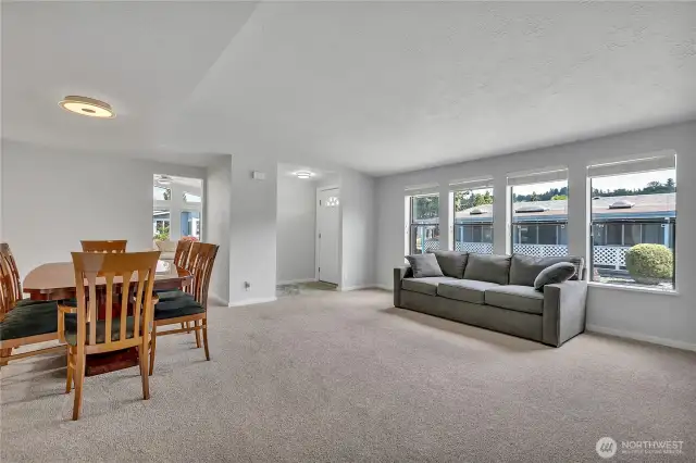 Living room / dining area. Freshly painted and new carpeting.